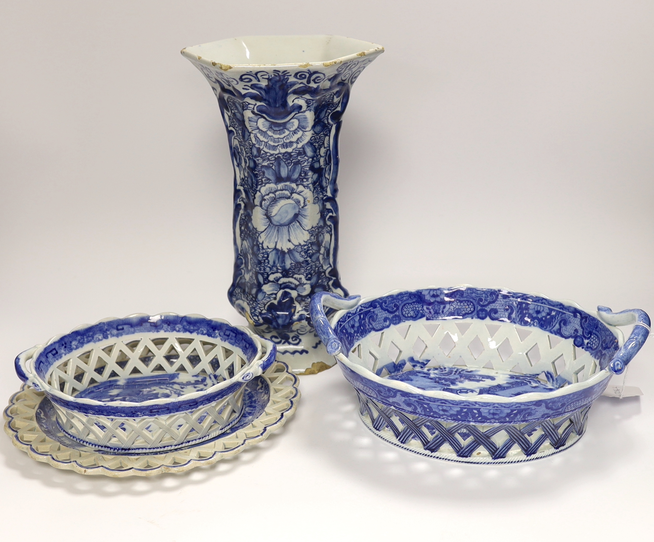 An 18th century hexagonal Delft vase, two pearlware blue and white baskets and a similar dish, tallest 27cm